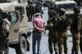 قوات الاحتلال تشن حملة اعتقالات تطال والد وشقيق الشهيد مجاهد النجار